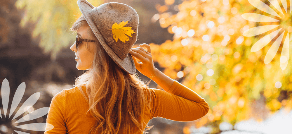 Eising Garden Centre woman dressed in orange with sun hat in autumn