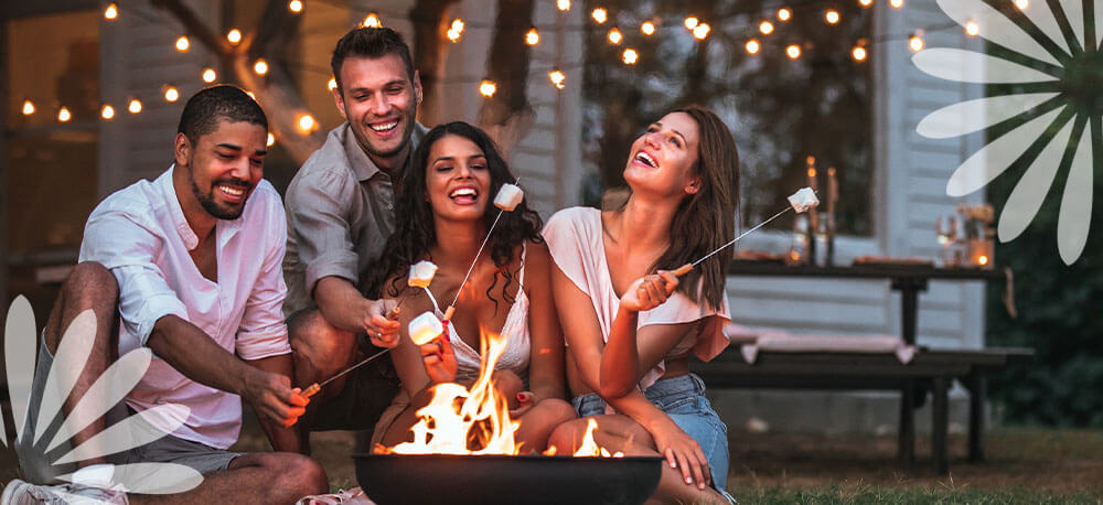 Eising Garden Centre - How to Host a May-Long Party in Your Backyard -gathering around a bonfire
